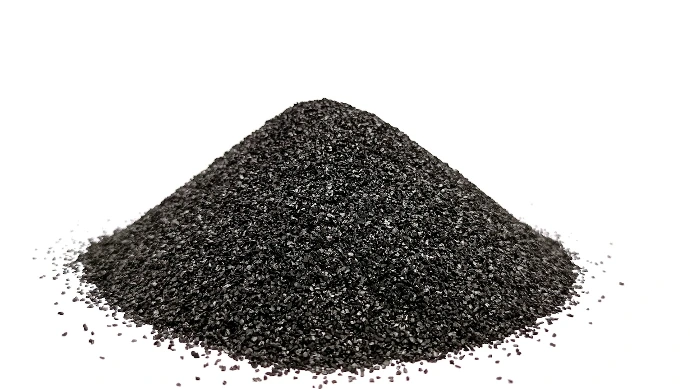A pile of black sand on a white background